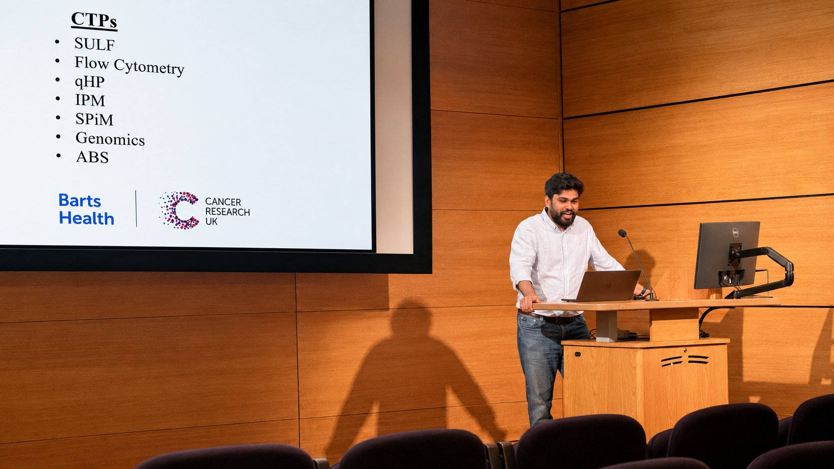 Dr. Umesh Dhawan presenting his research at a scientific meeting.